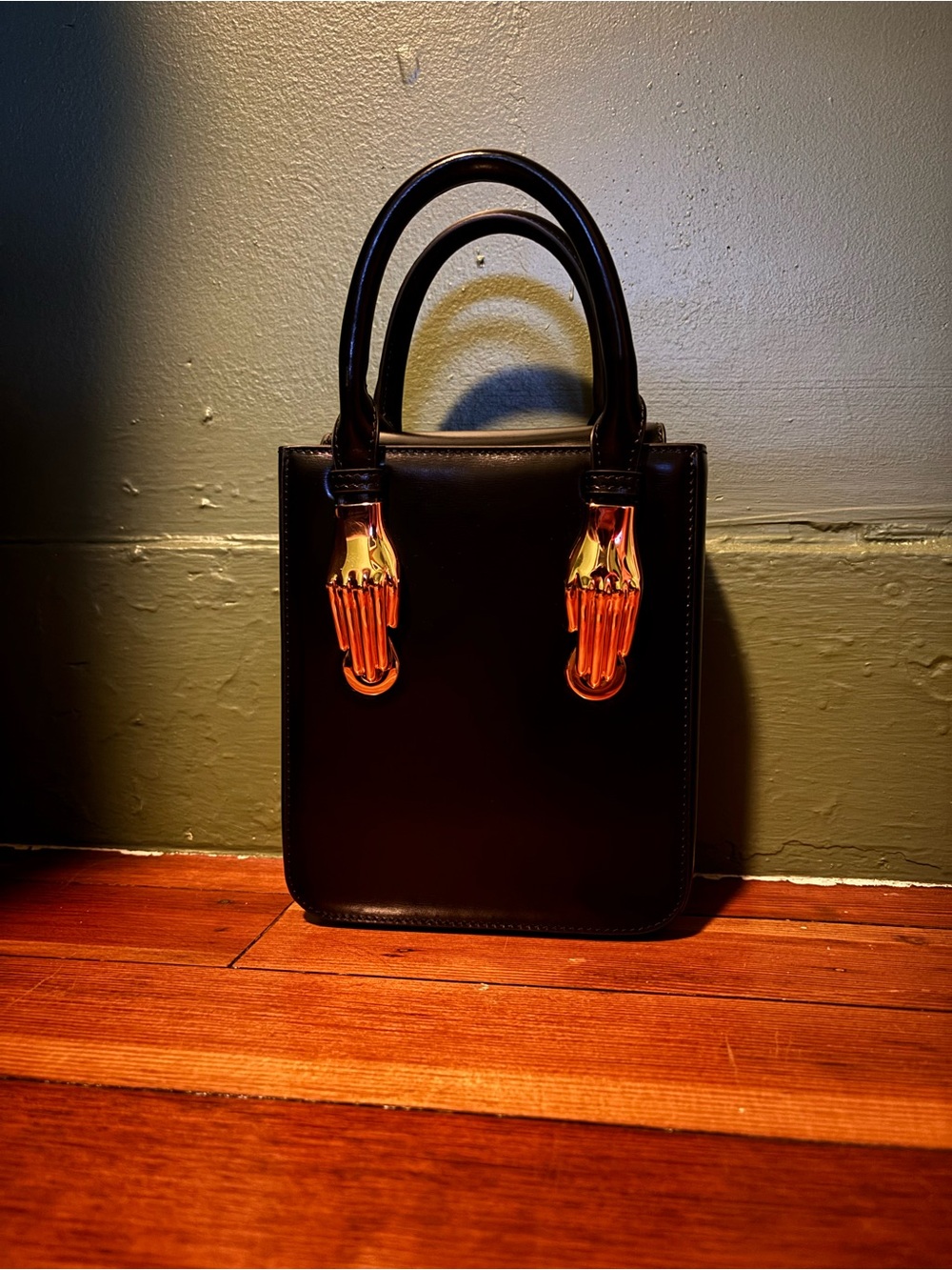 Black Structured Top-Handle Bag with Gold Hand Hardware